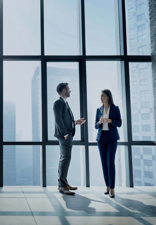 Built for Advisors by Advisors section. A man and a woman talking next to an office window.